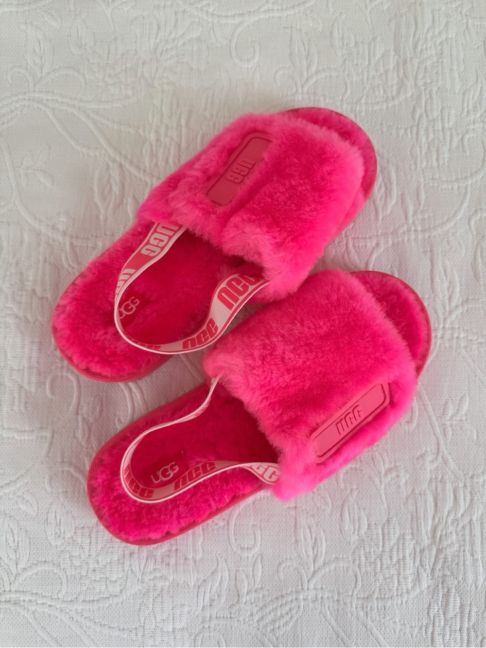 Bright neon pink UGG fluffy sliders/slippers